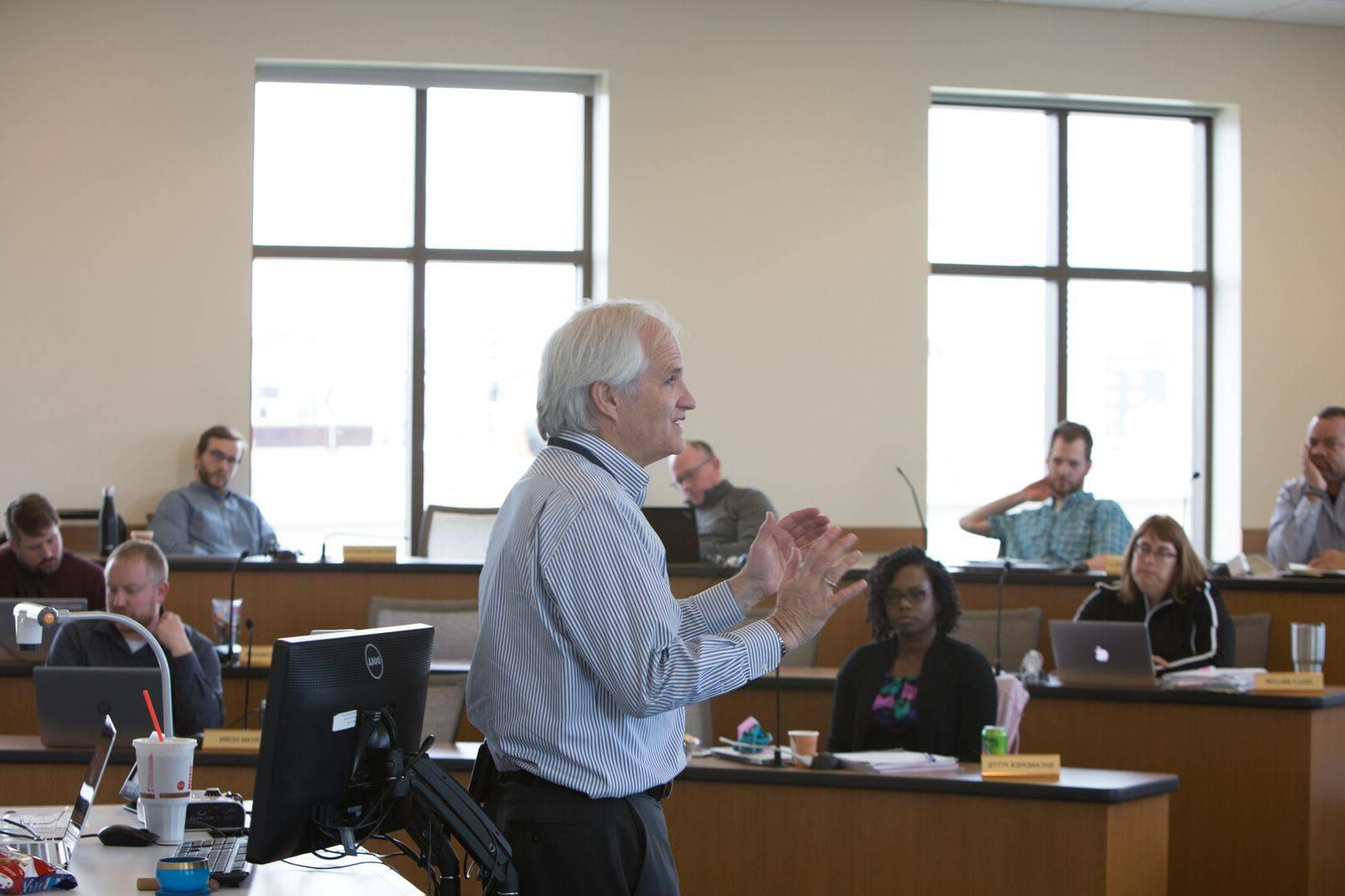 Professor speaking to classroom of students